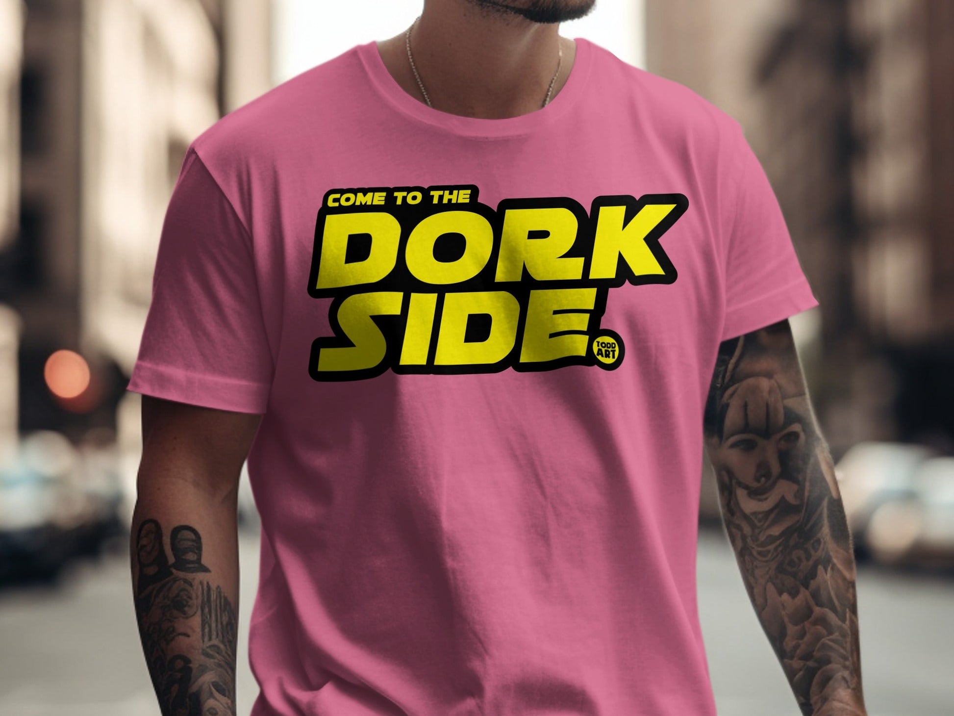 Pink t-shirt with "Come to the Dork Side" text and a comic art logo.