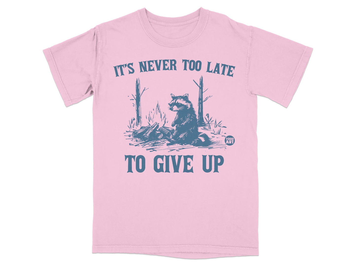 Pink t-shirt with blue text and raccoon graphic.