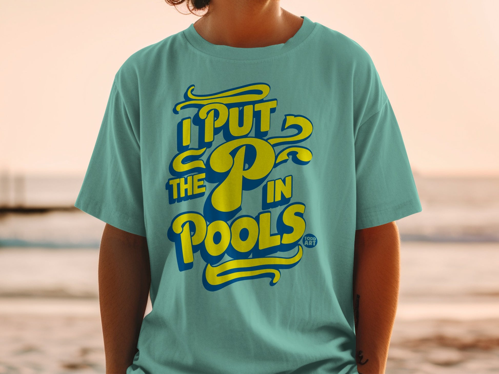 Teal t-shirt with "I PUT the P in POOLS" in yellow and blue lettering.