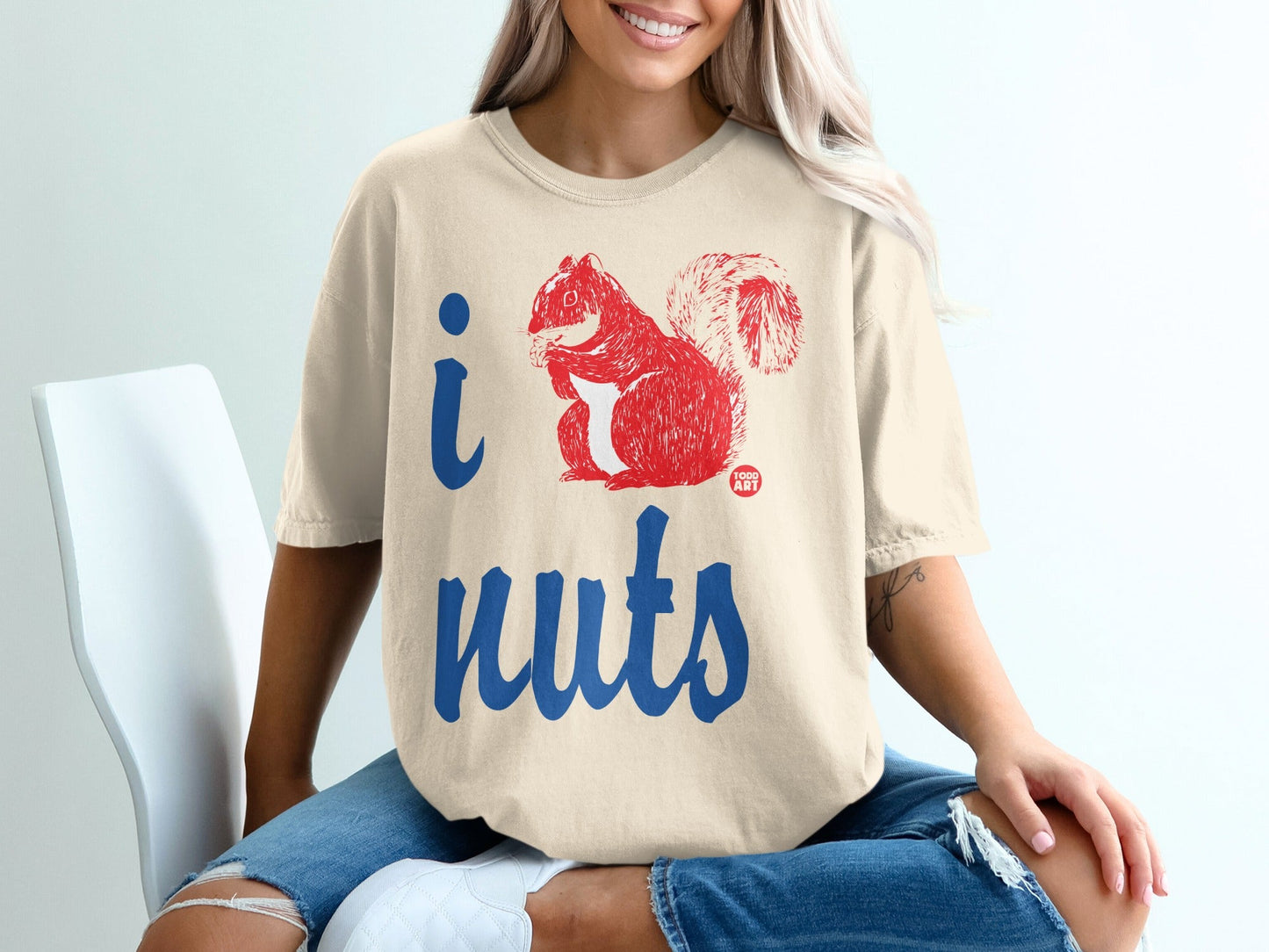 T-shirt with "I nuts" text and a red squirrel graphic.