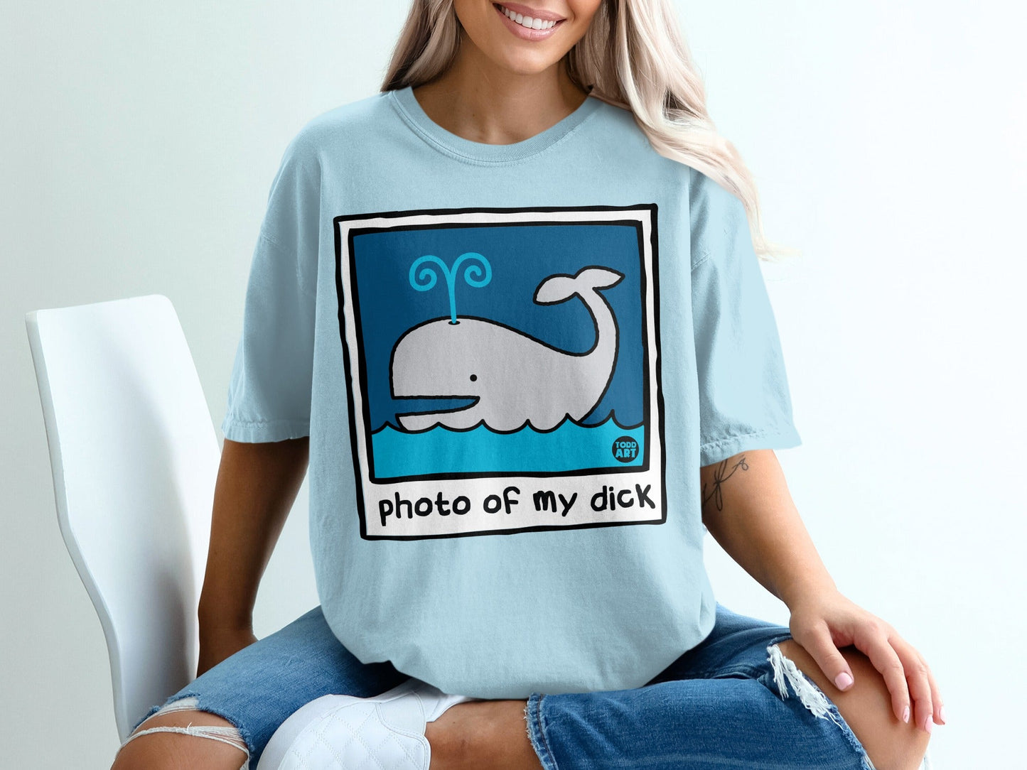 Light blue t-shirt with cartoon whale illustration and "photo of my dick" text.