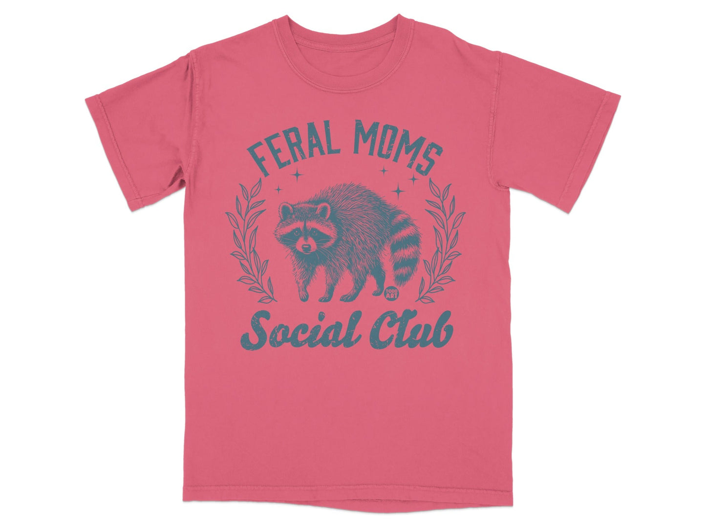 Coral t-shirt with distressed raccoon and "Feral Moms Social Club" text.