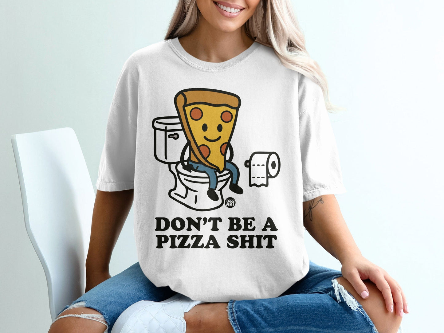 T-shirt with graphic of pizza slice on toilet, saying "Don't be a pizza shit."
