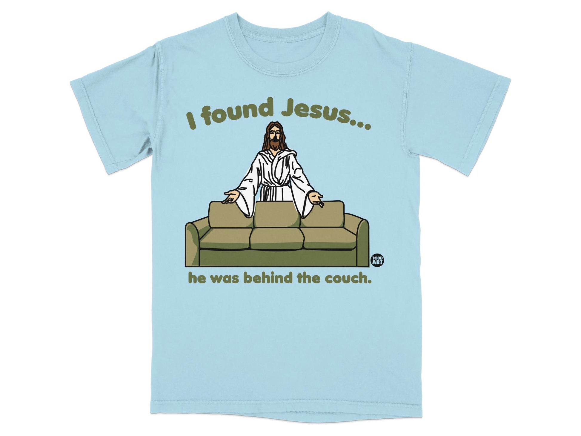 Light blue t-shirt with Jesus behind a couch, text reads "I found Jesus... he was behind the couch."