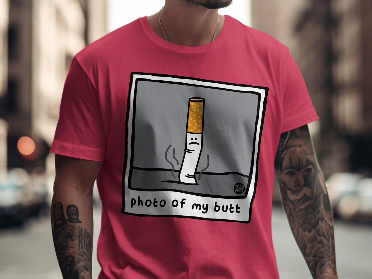 T-shirt with a cartoon cigarette with a sad face and "photo of my butt" text.