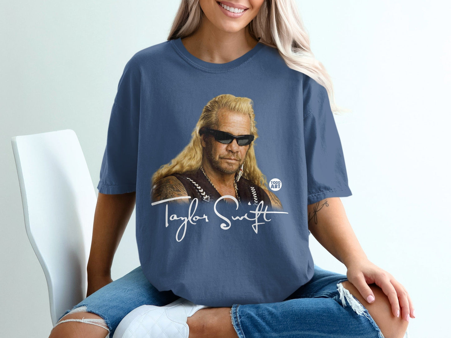Dog the Bounty Hunter wearing a Taylor Swift t-shirt.
