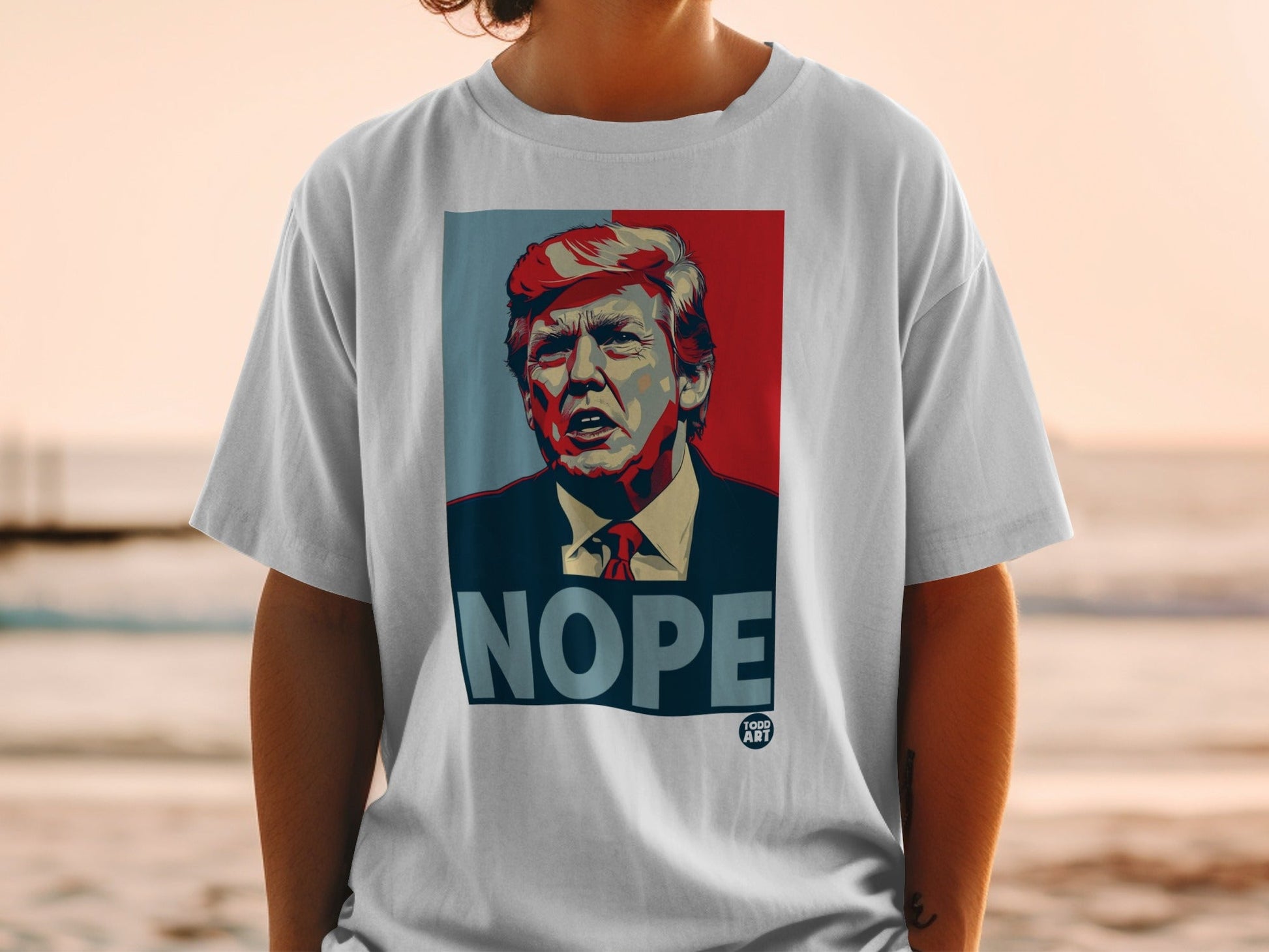 White t-shirt with portrait of Donald Trump and "NOPE" text.