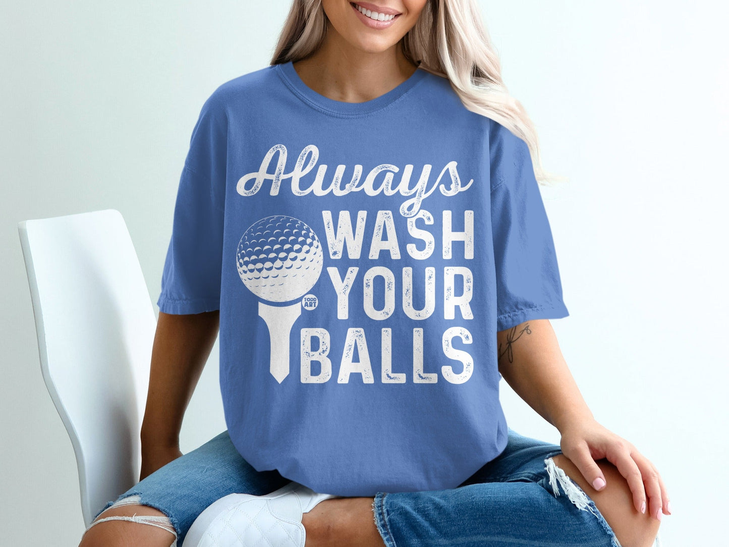 Blue t-shirt with white text "Always Wash Your Balls" and a golf ball on a tee.