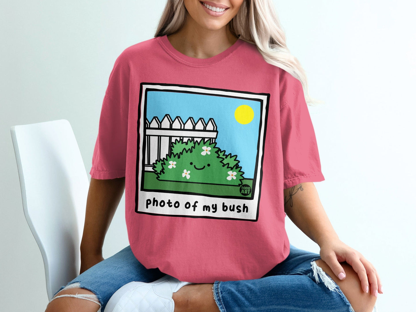 Pink t-shirt with cartoon bush and text "photo of my bush".
