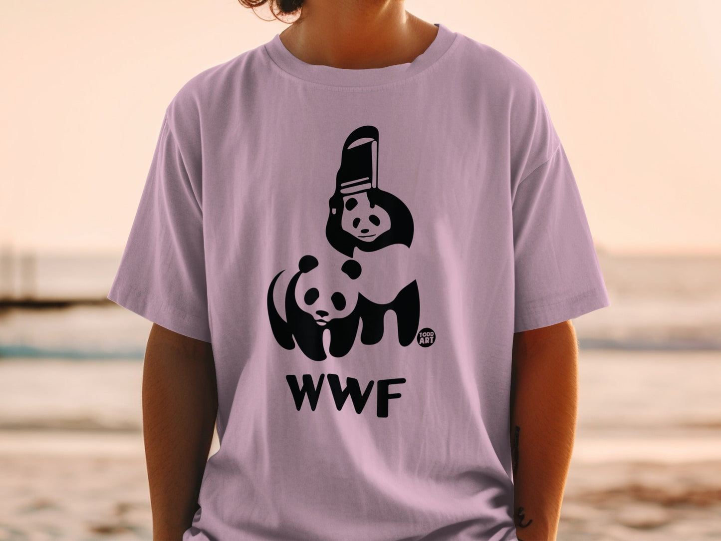 Panda illustration and WWF logo on a light purple t-shirt.