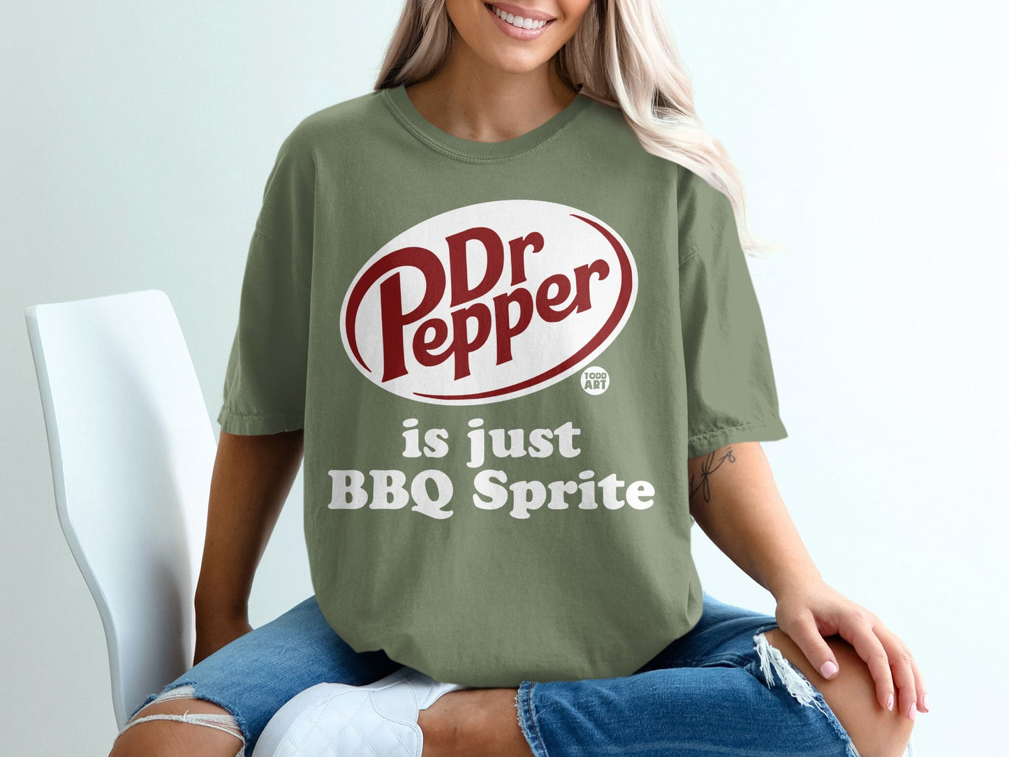 Green t-shirt with Dr Pepper logo and "is just BBQ Sprite" text.