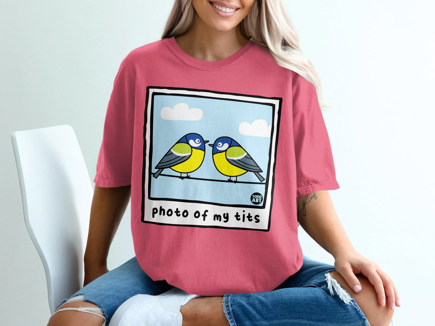 Two blue tits perched on a wire, with "photo of my tits" text.