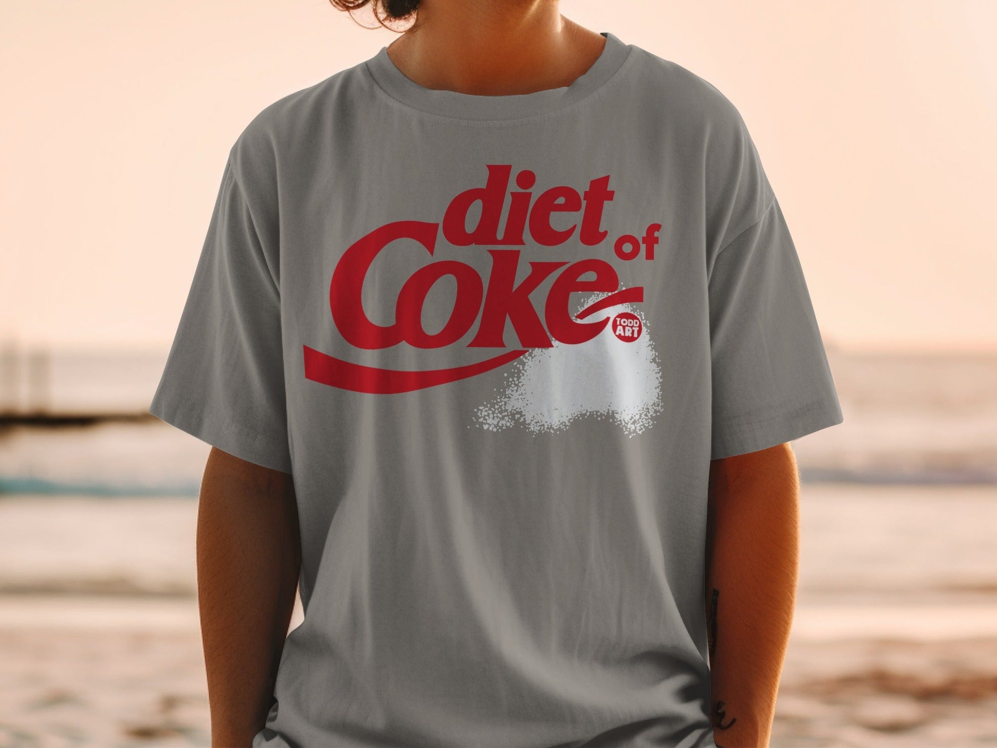 Grey t-shirt with "diet Coke" logo and spilled sugar.