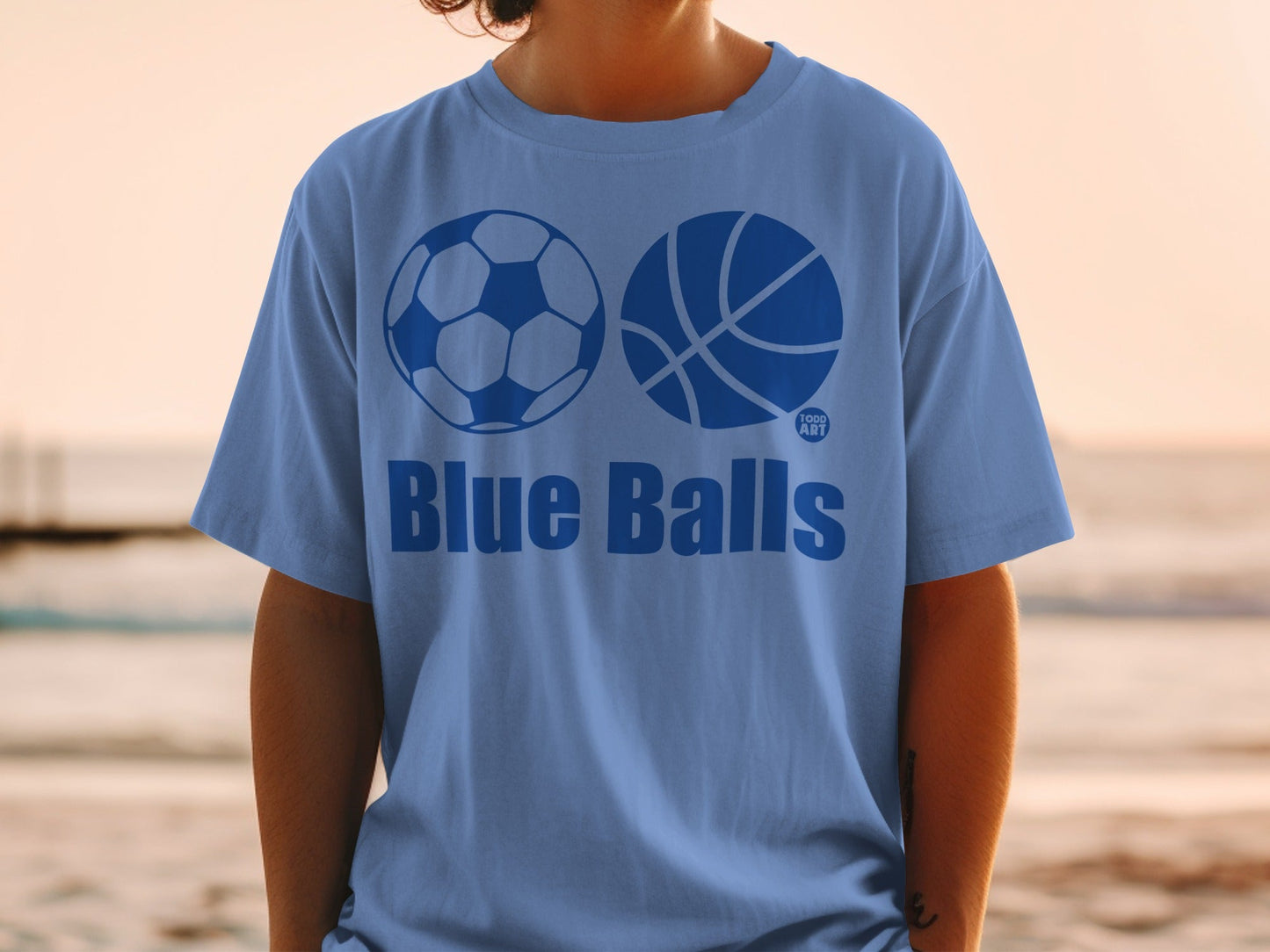 Blue Balls t-shirt with soccer and basketball graphics.