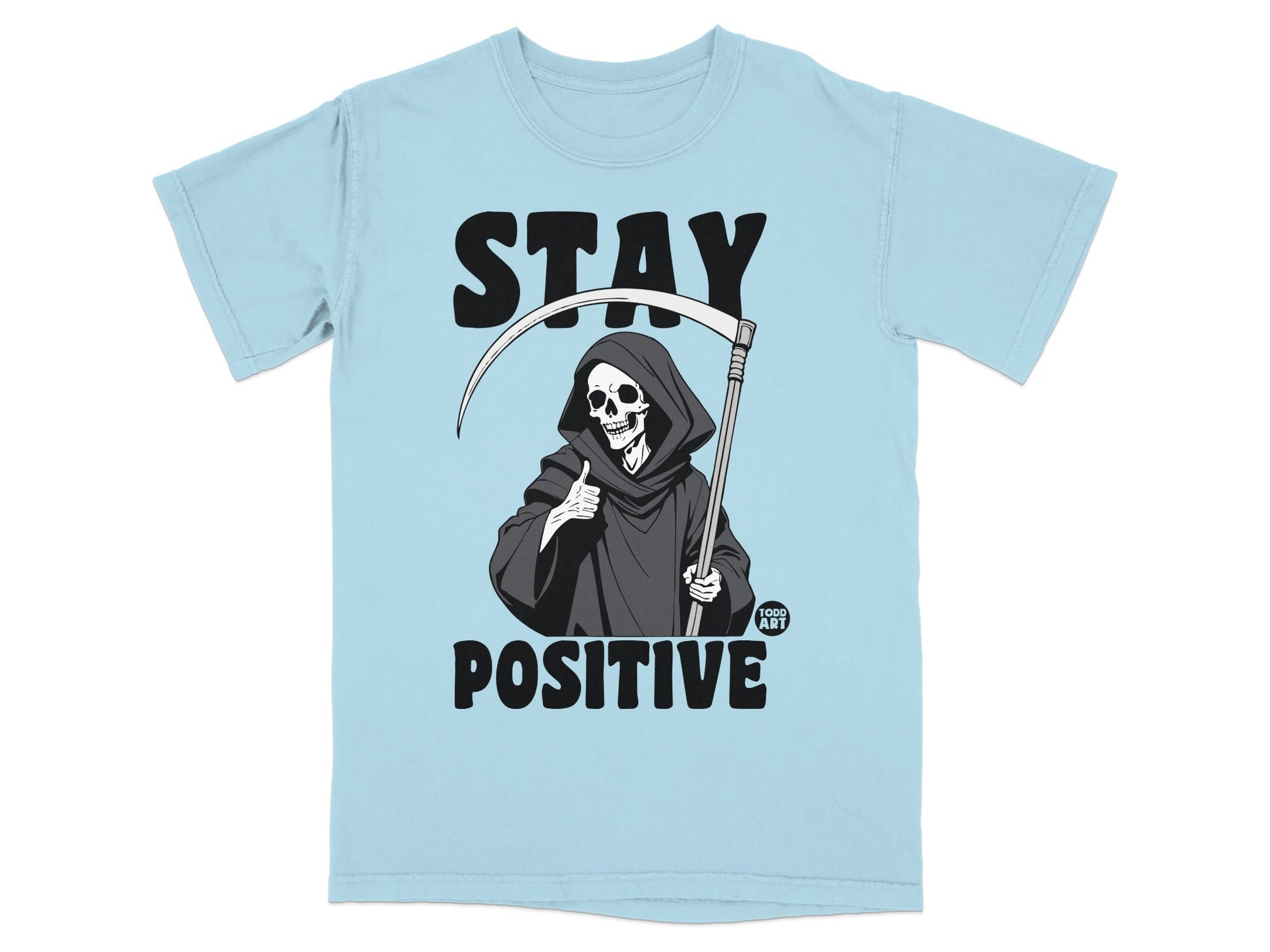 Light blue t-shirt with Grim Reaper giving a thumbs up and "STAY POSITIVE" text.