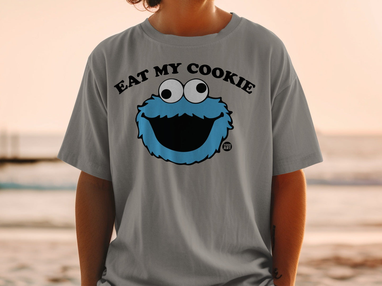 Grey t-shirt with Cookie Monster saying "EAT MY COOKIE".