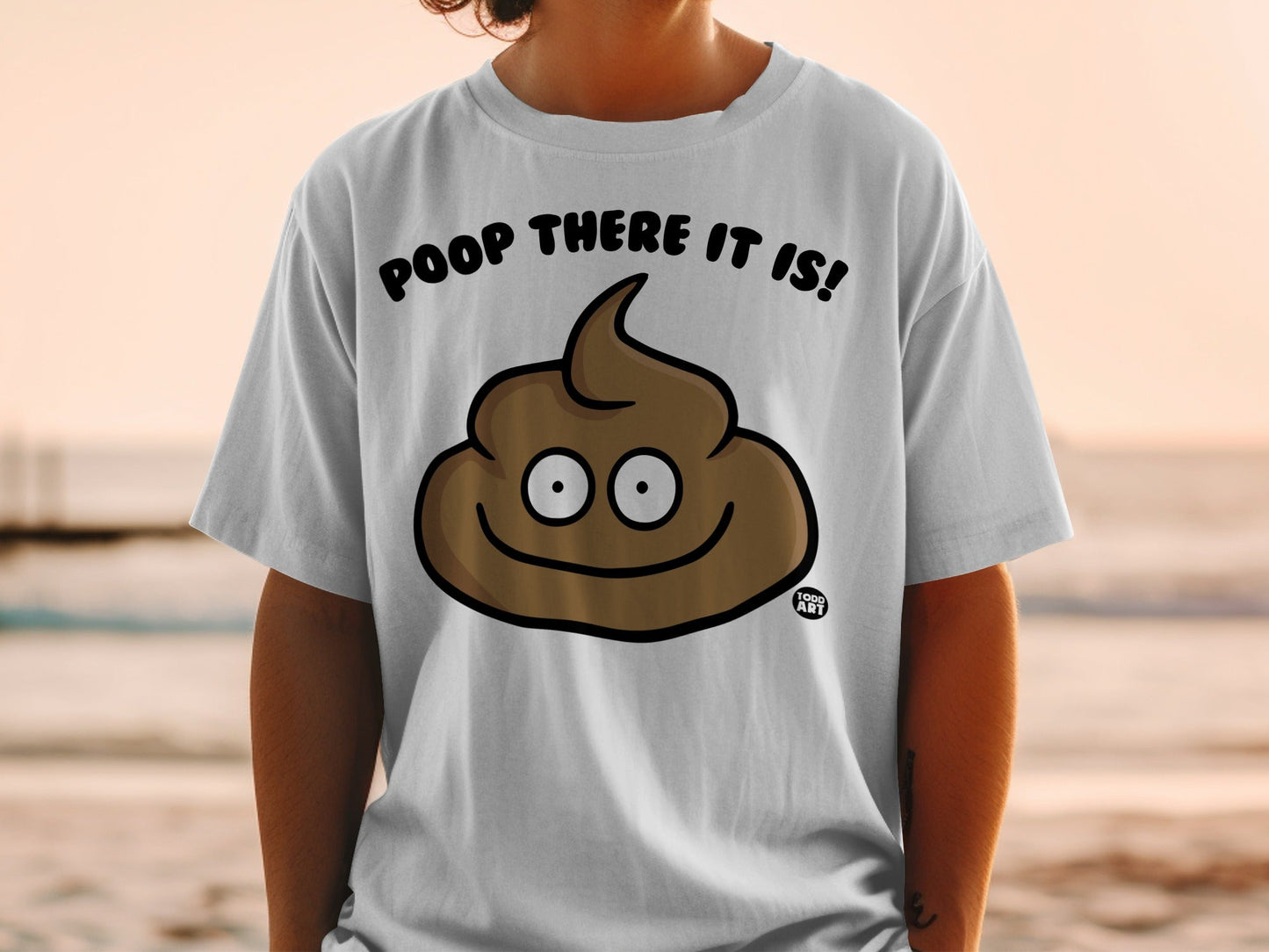 White t-shirt with a smiling poop emoji and the text "Poop there it is!"