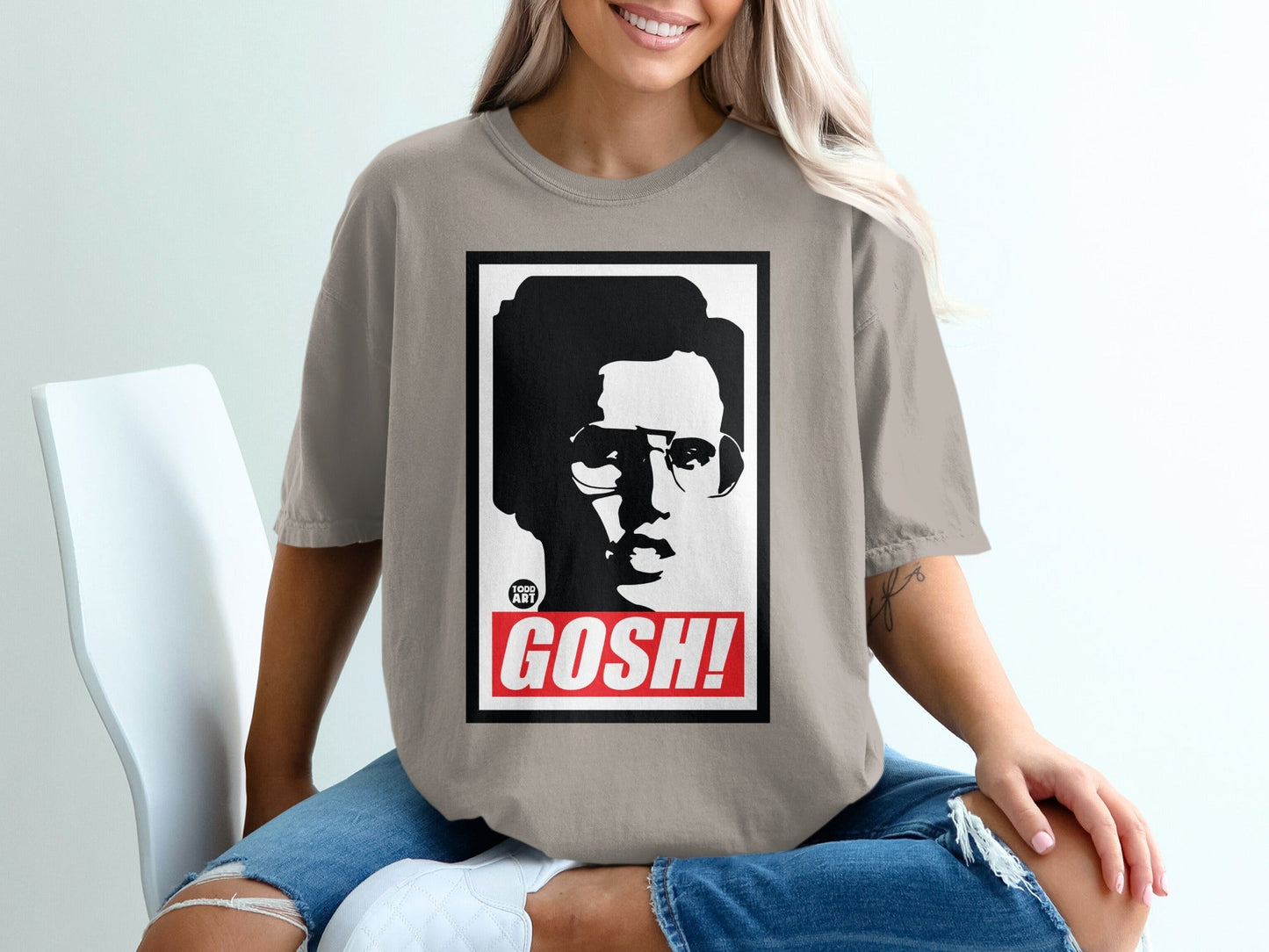 T-shirt with a black and white portrait and the word "GOSH!".