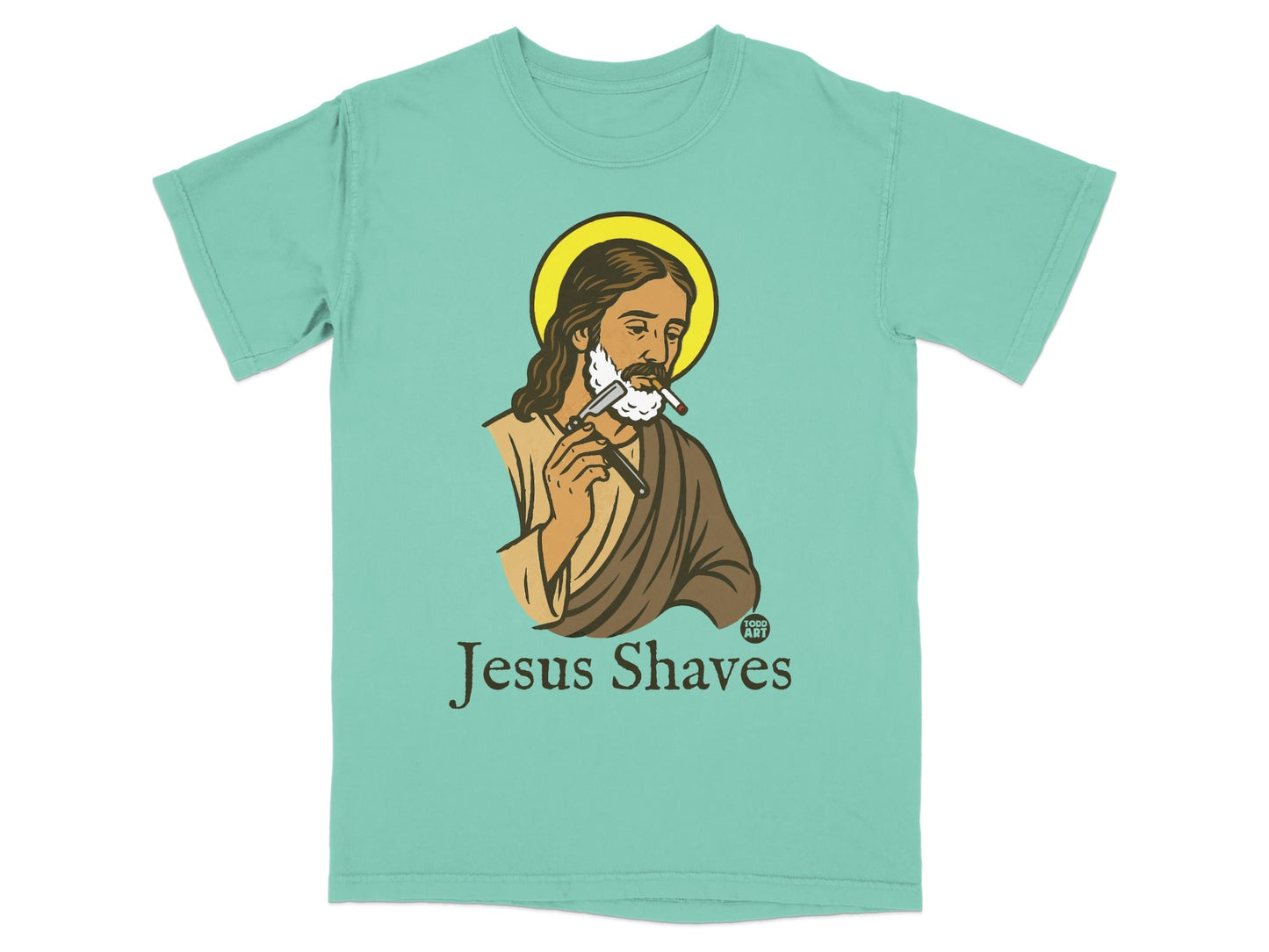 Turquoise t-shirt with Jesus shaving and the text "Jesus Shaves" and "GOD'S ART".