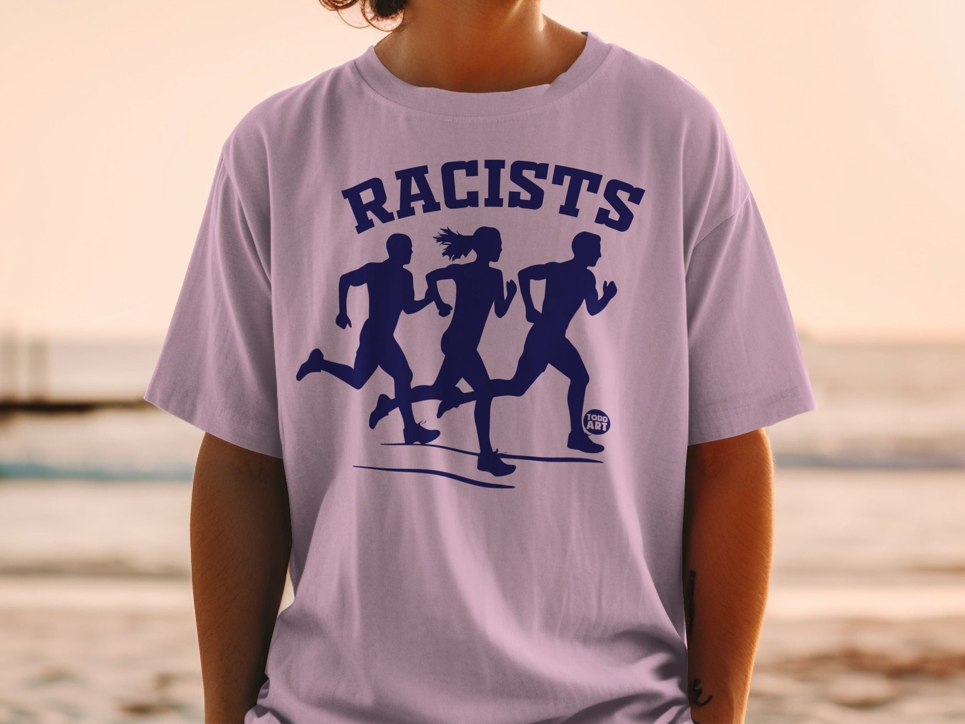 Silhouetted runners on t-shirt with "RACISTS" text and "TODO ART" logo.