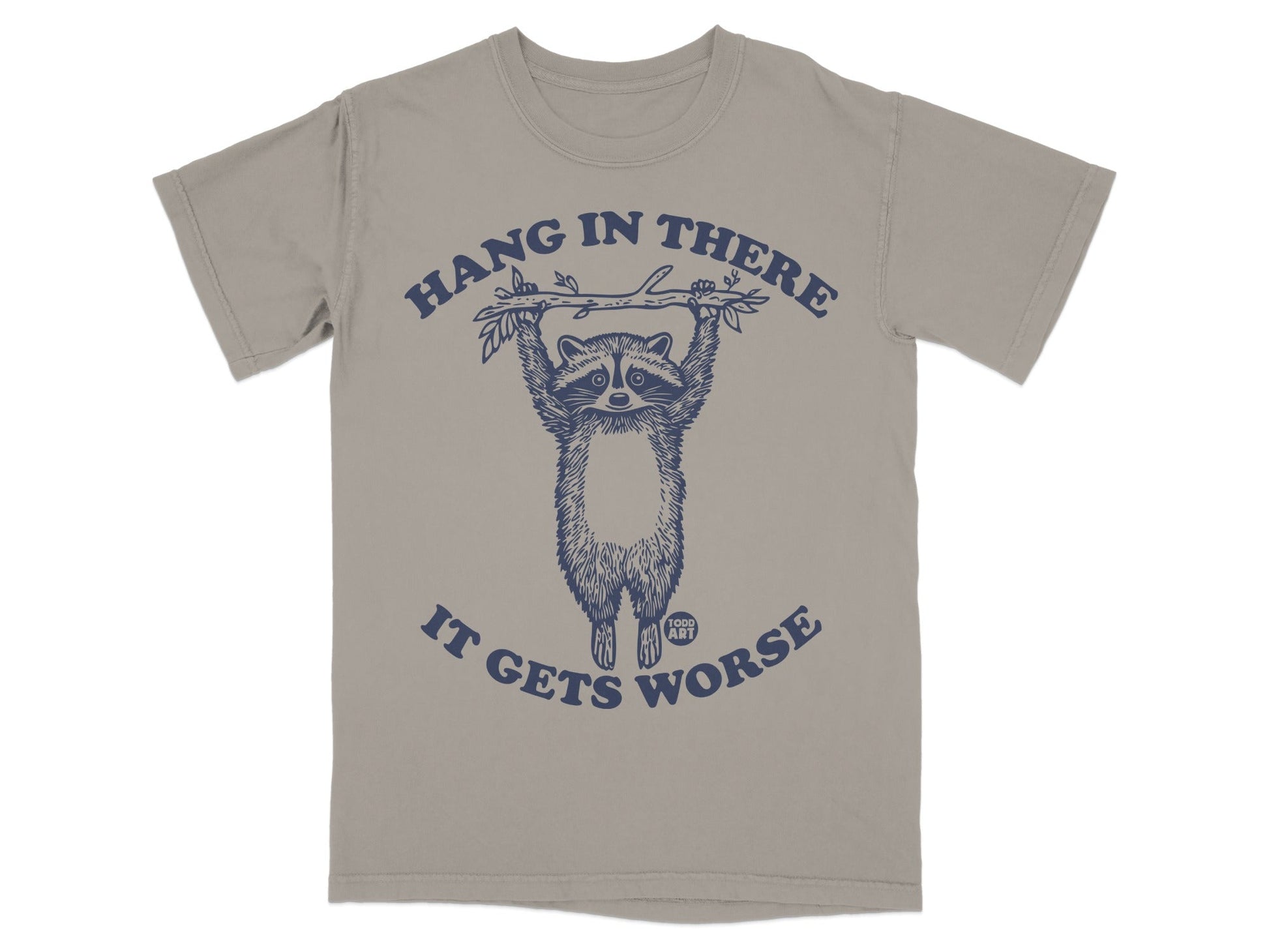 T-shirt with a raccoon hanging from a branch, text reads "Hang in there, it gets worse."