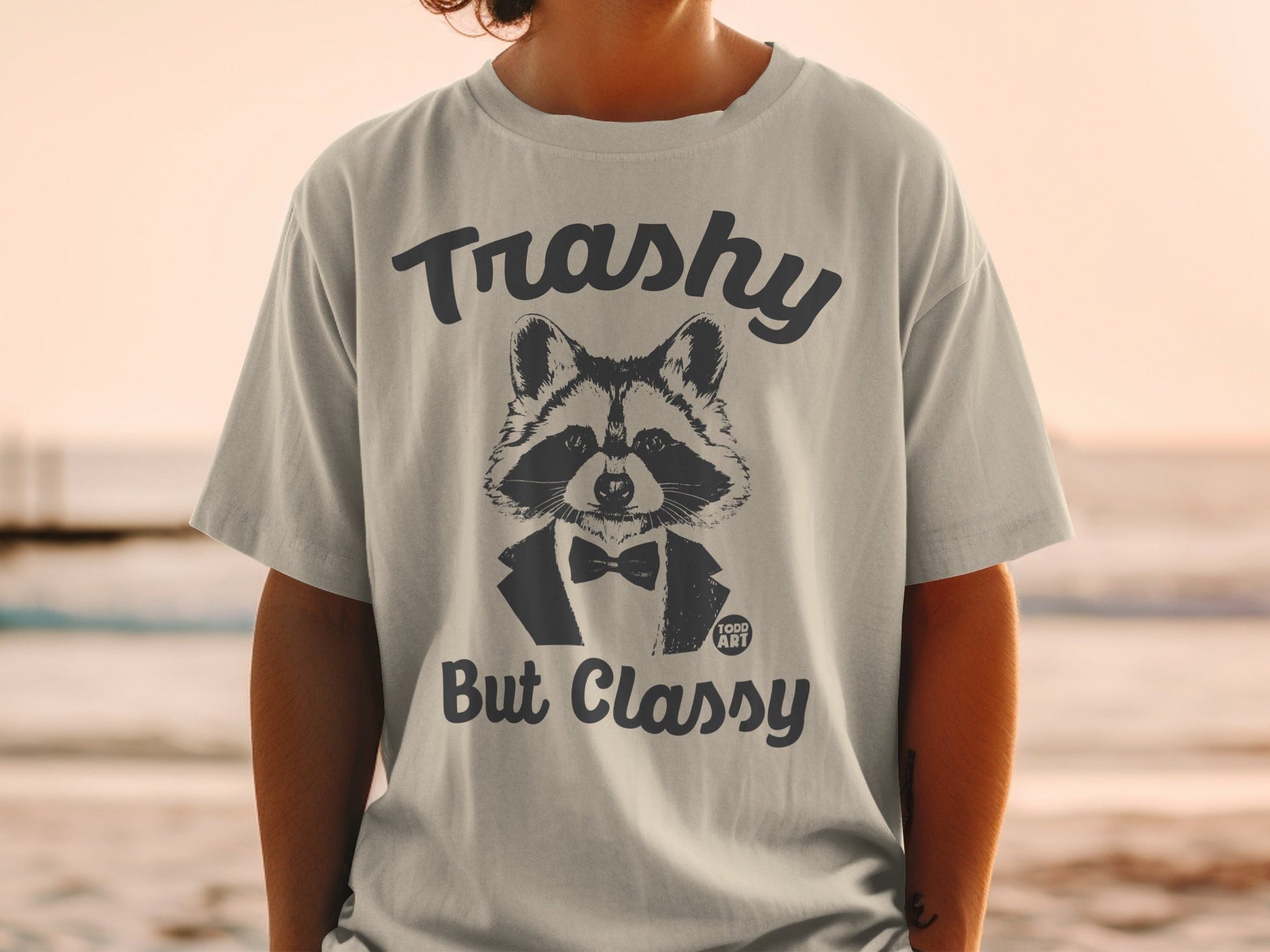 Raccoon in tuxedo with "Trashy But Classy" text on t-shirt.