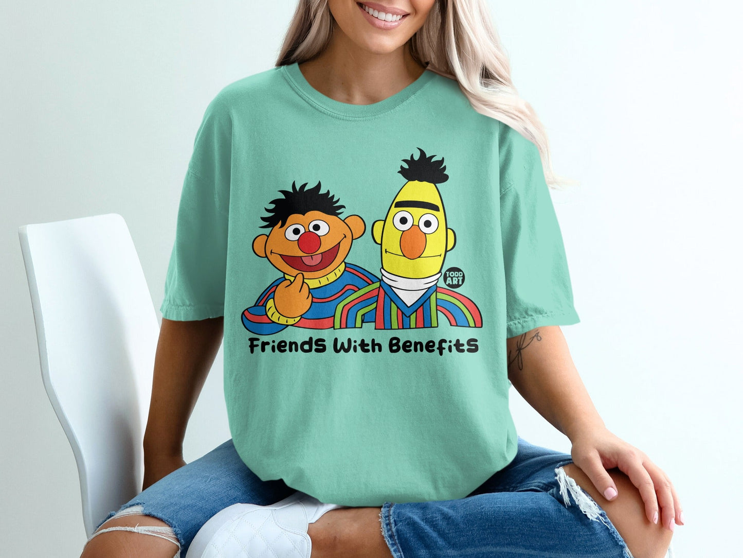 Bert and Ernie from Sesame Street on a mint green t-shirt.
