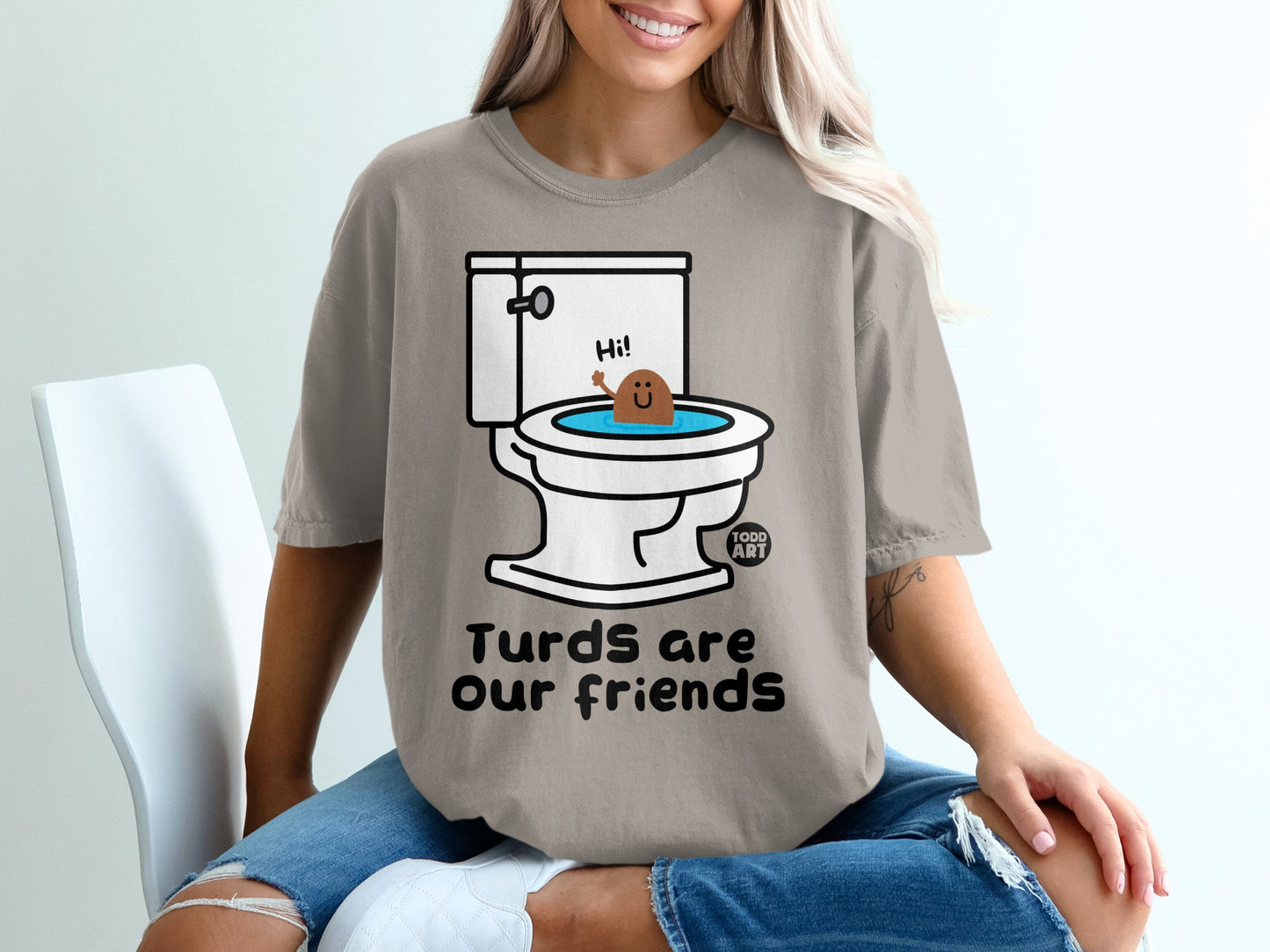Toilet with a smiling brown character, text "Turds are our friends".