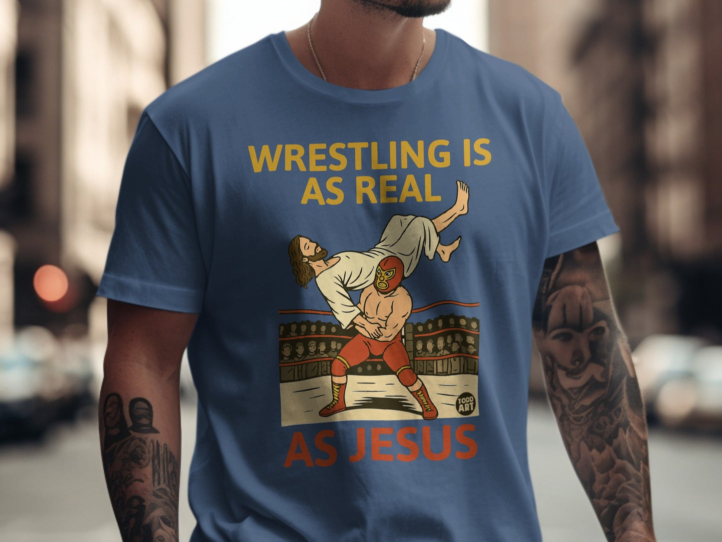 T-shirt graphic: Wrestling is real as Jesus, with Jesus being body-slammed.