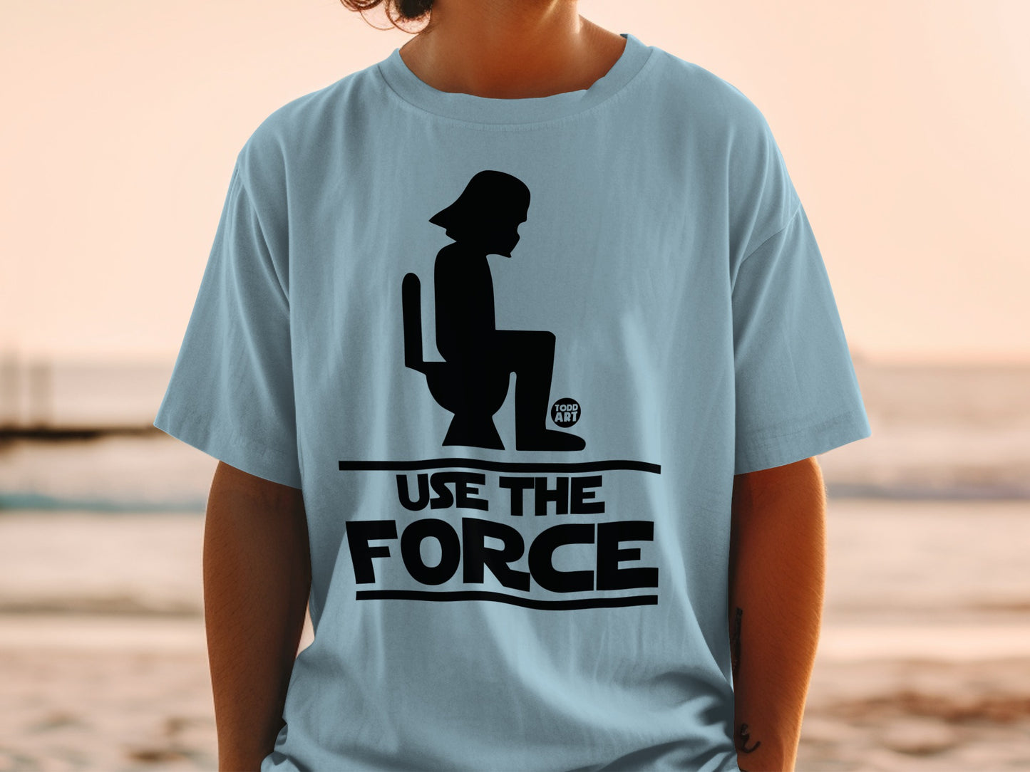 Light blue t-shirt with Darth Vader on a toilet and "Use the Force" text.