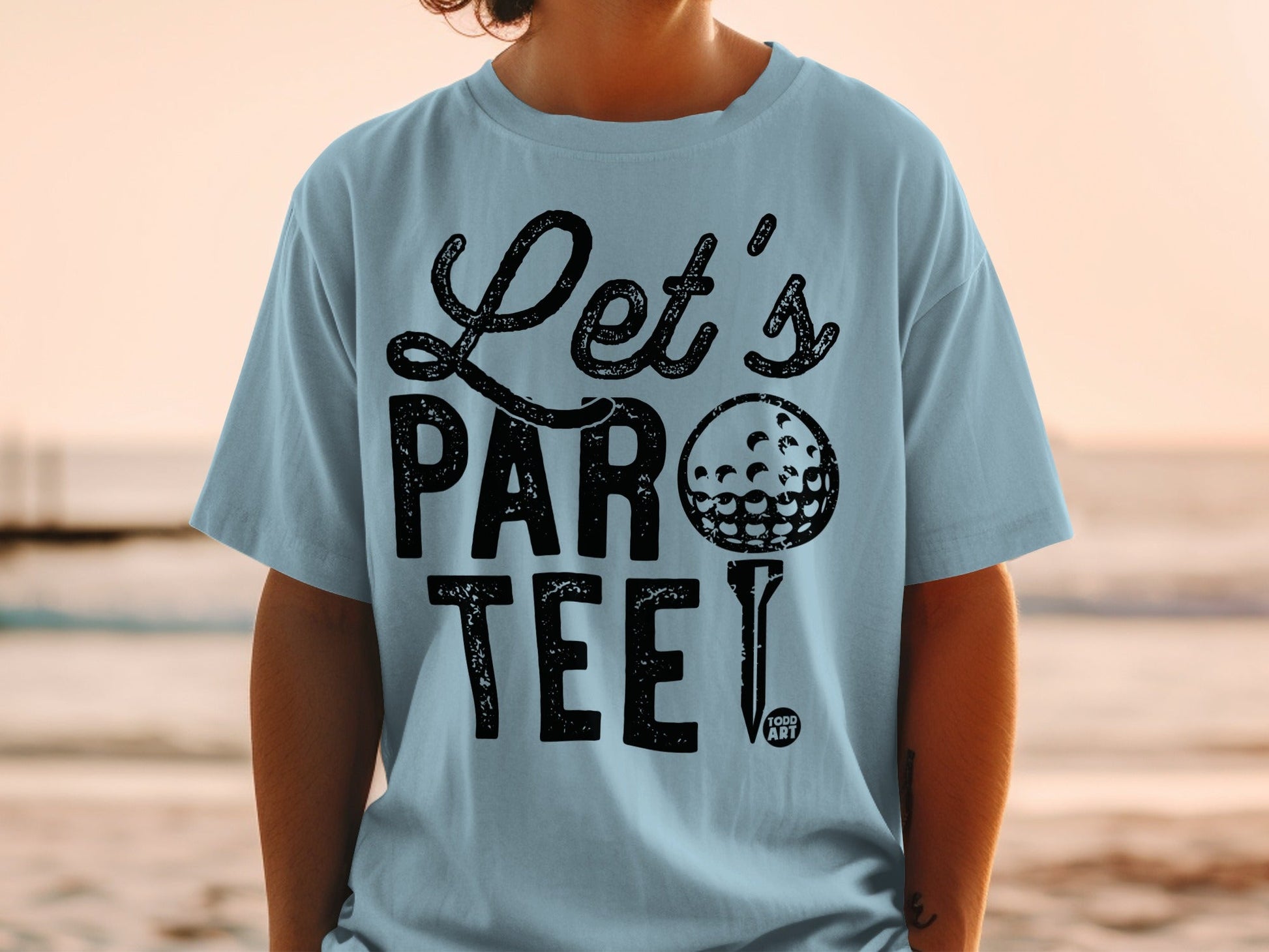 Light blue t-shirt with "Let's Par Tee!" and golf ball graphic.