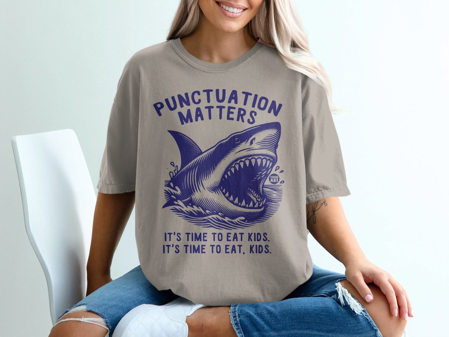Shark graphic t-shirt with "Punctuation Matters" and "It's time to eat kids." text.