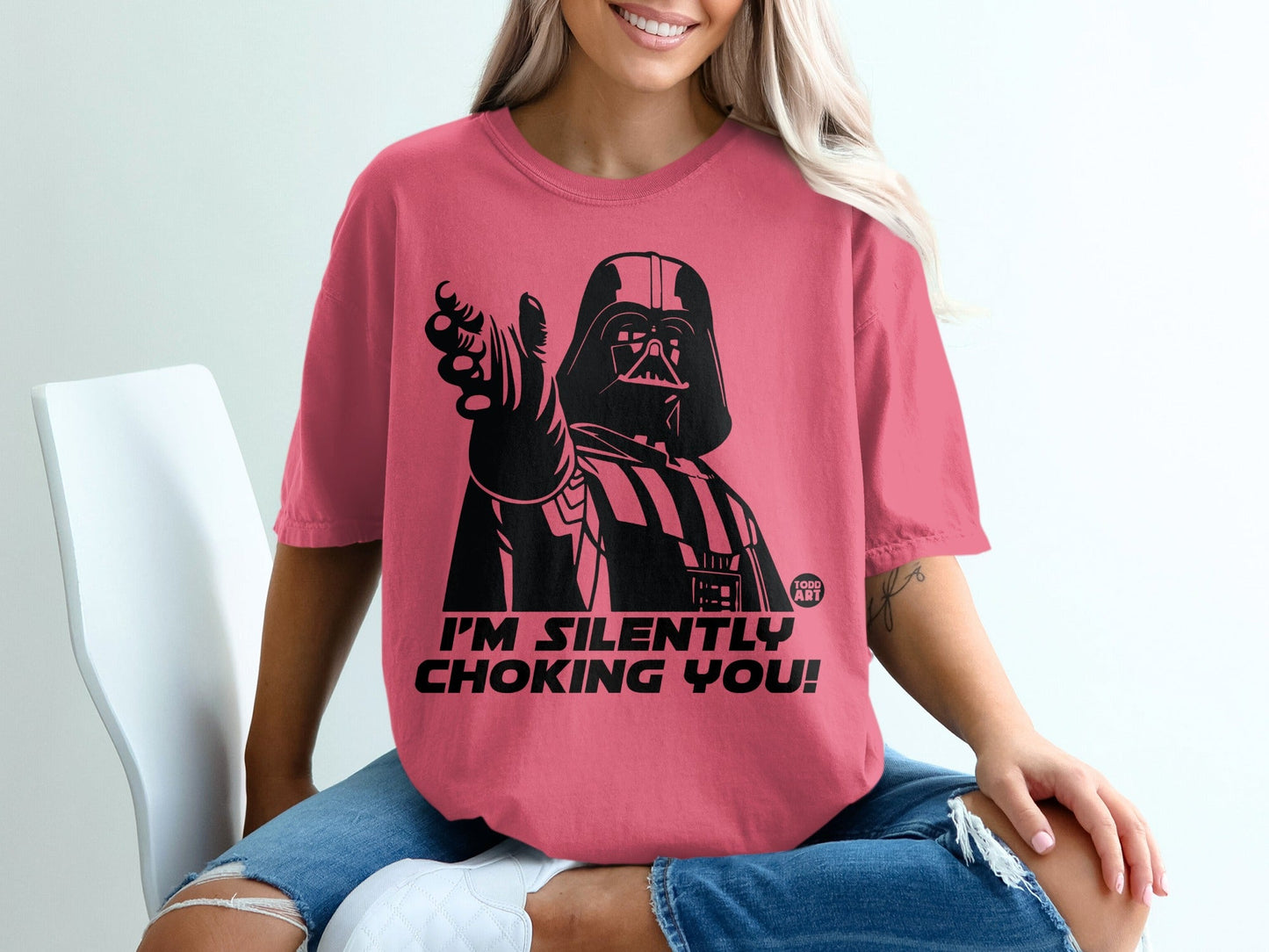 Darth Vader pointing and saying "I'm silently choking you!" on a pink t-shirt.
