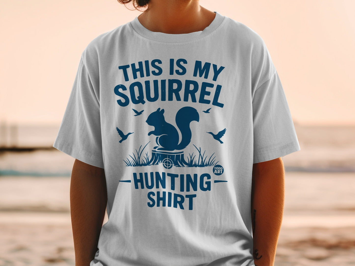 White t-shirt with blue text: "This is my squirrel hunting shirt."