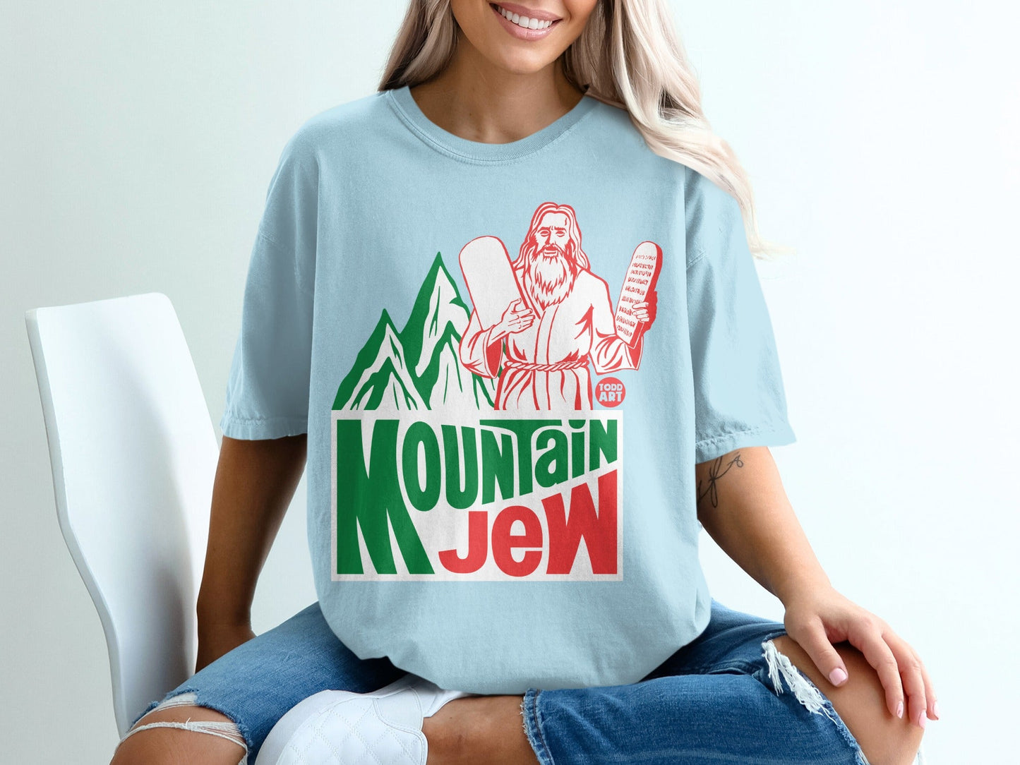 Light blue t-shirt with "Mountain Jew" design and Moses holding tablets.
