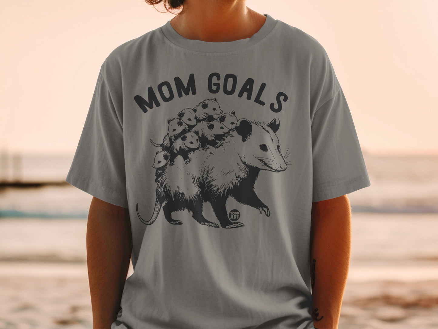 Mom goals graphic on a gray t-shirt with an opossum and babies.