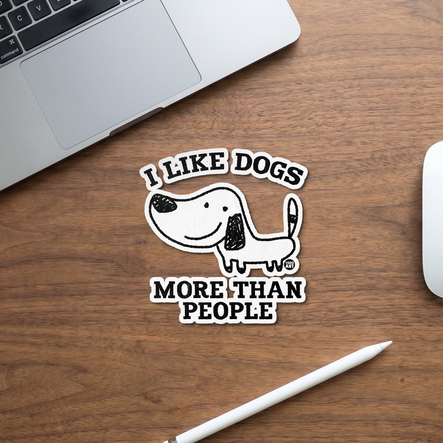 Sticker with "I LIKE DOGS MORE THAN PEOPLE" text and cartoon dog illustration.