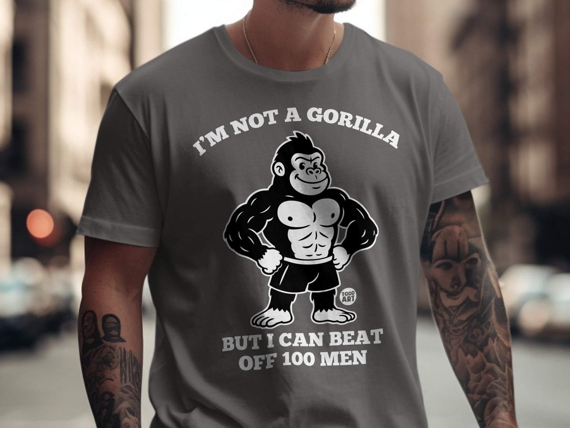 Gray t-shirt with gorilla graphic and text "I'm not a gorilla but I can beat off 100 men".