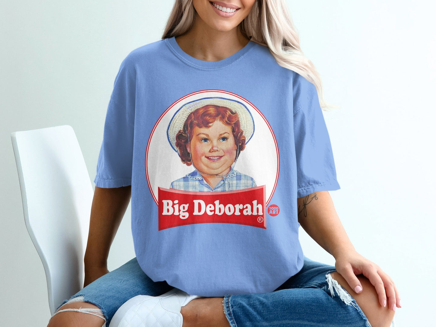 Blue t-shirt with a vintage-style "Big Deborah" food brand logo.