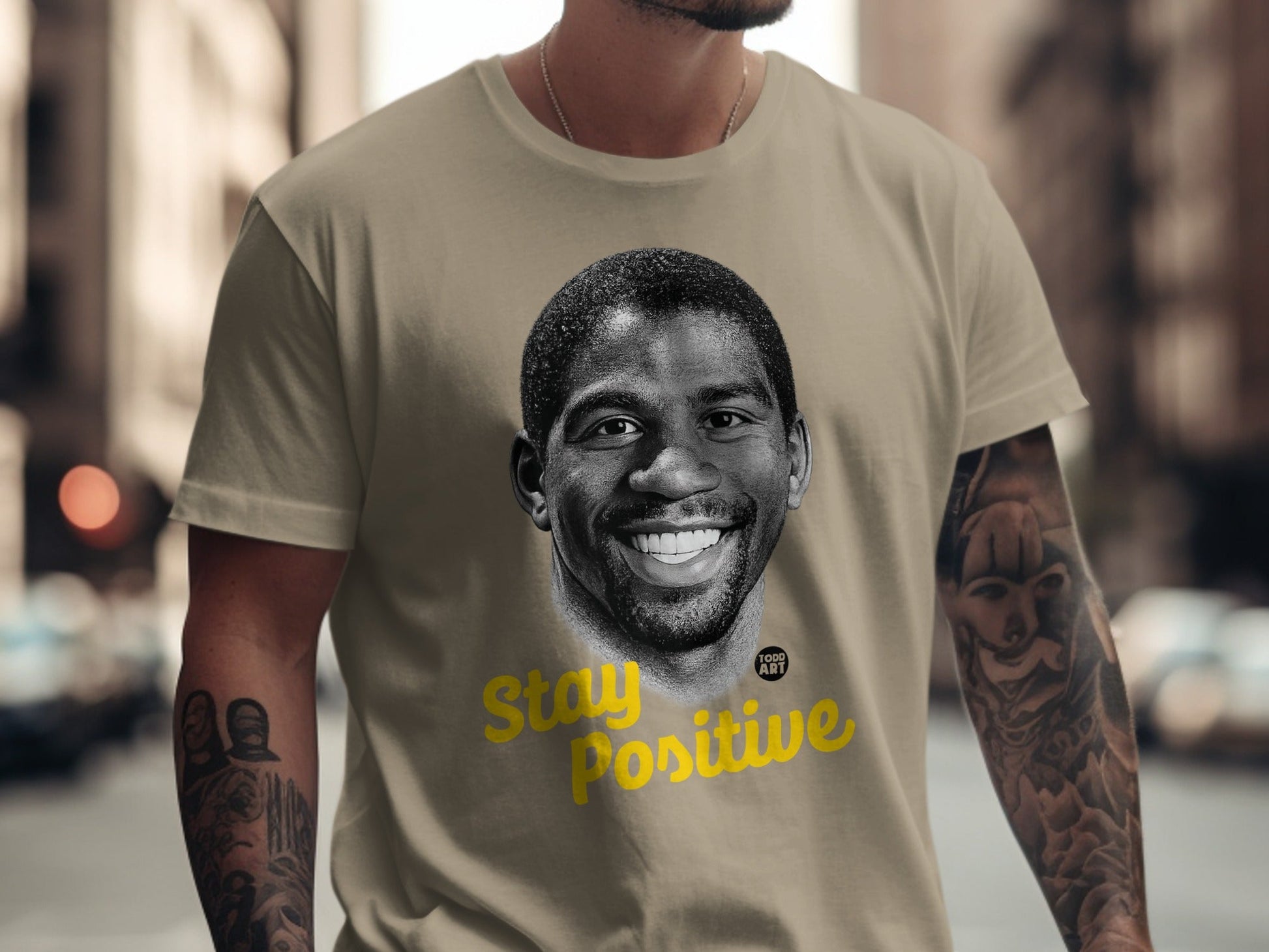 T-shirt with Magic Johnson portrait and "Stay Positive" text.