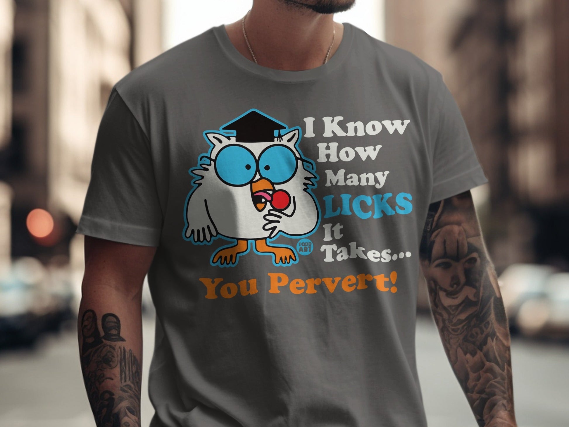 Gray t-shirt with cartoon owl wearing graduation cap and text "I Know How Many Licks It Takes... You Pervert!".