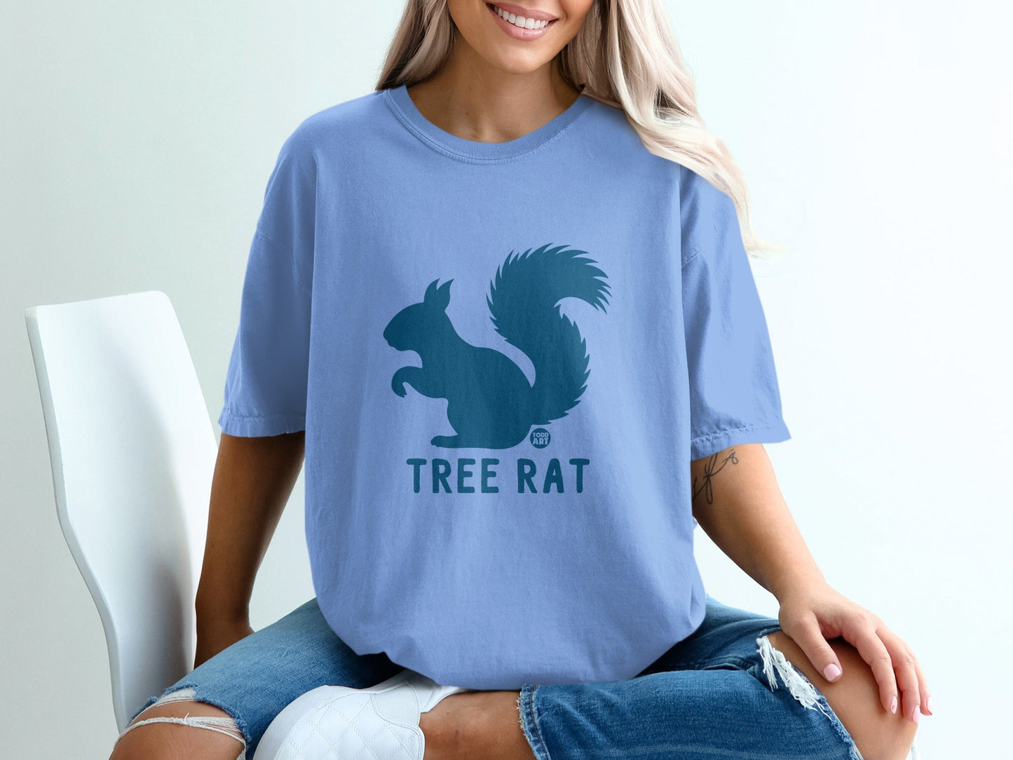 Blue t-shirt with squirrel graphic and "TREE RAT" text.