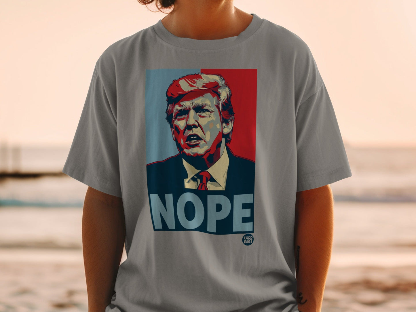 Donald Trump portrait with "NOPE" text on a gray t-shirt.