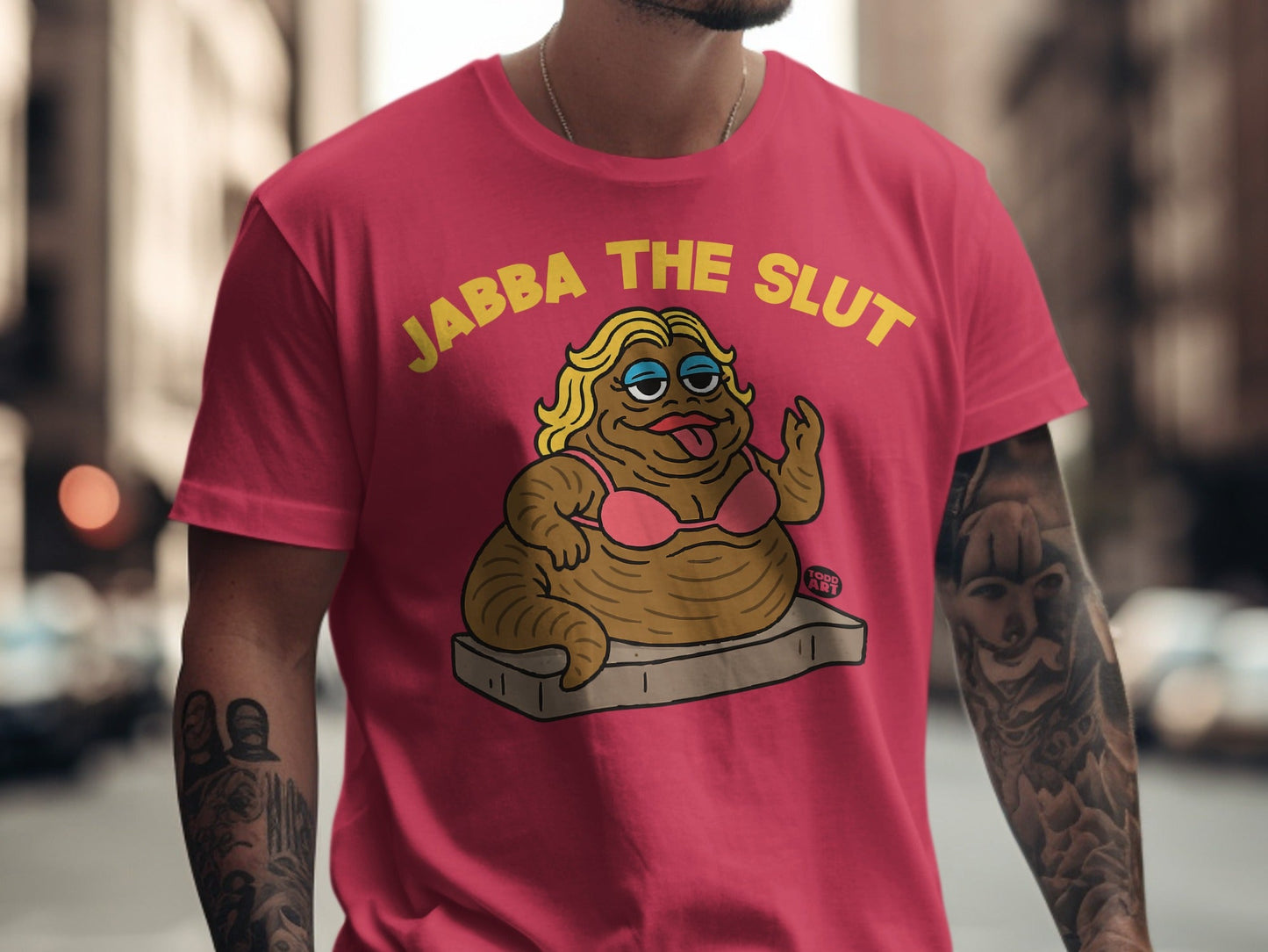 Pink t-shirt with "JABBA THE SLUT" text and cartoon character.