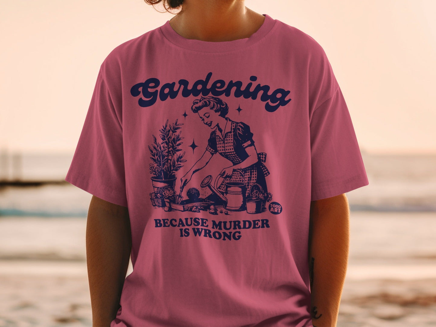 T-shirt with a vintage graphic of a woman gardening, text reads "Gardening is Wrong".