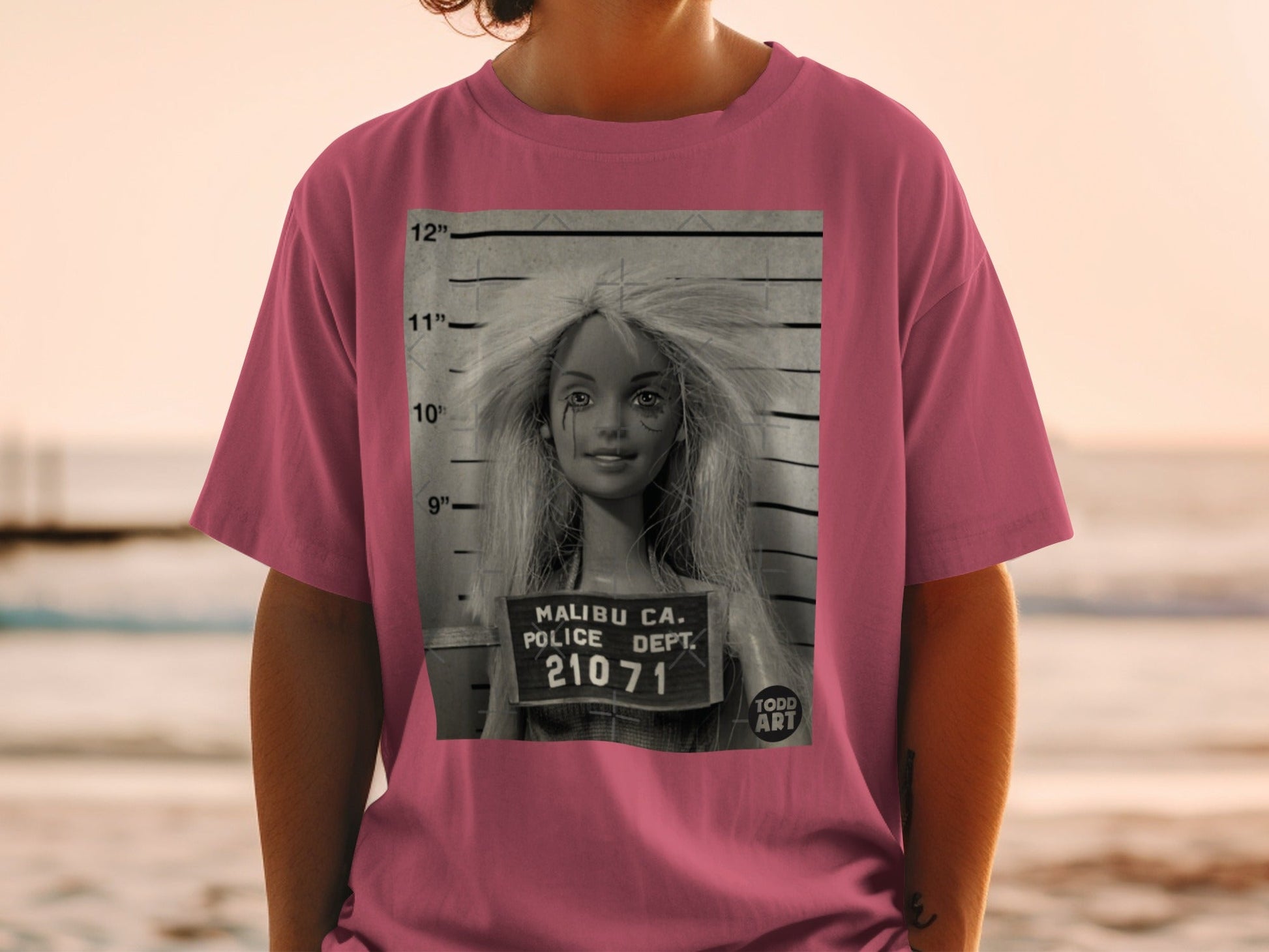 T-shirt with mugshot of a blonde woman, Malibu Police Dept. 21071.