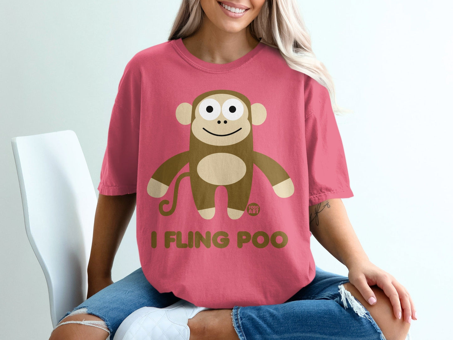 Pink t-shirt with a cartoon monkey graphic and the text "I FLING POO".