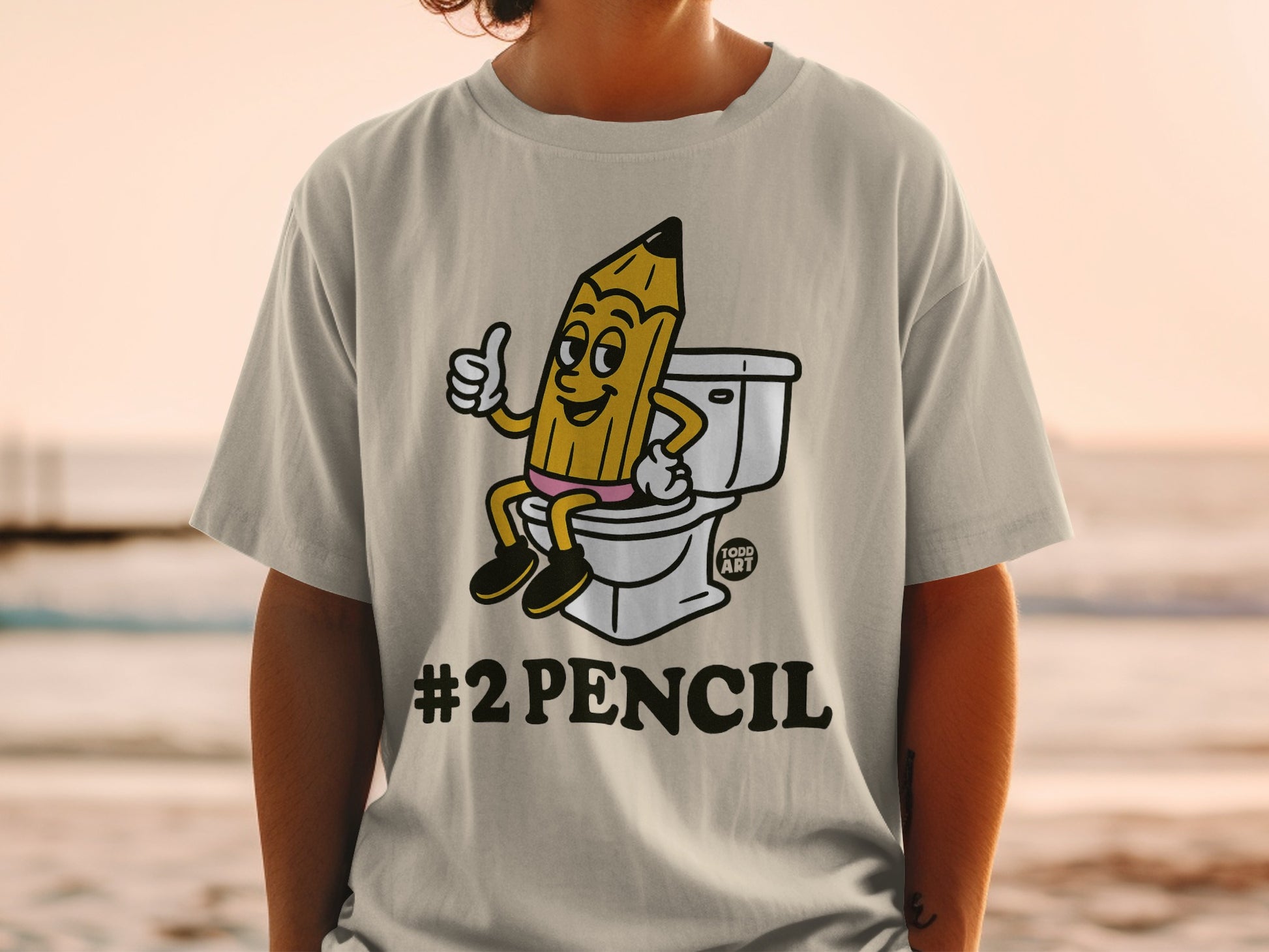 Pencil character giving a thumbs up on a toilet, "#2PENCIL" text.