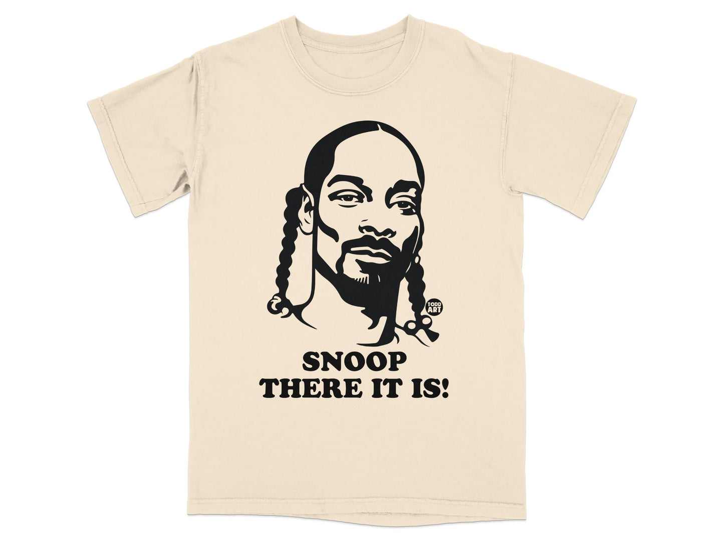 Cream t-shirt featuring a black graphic of Snoop Dogg with "Snoop There It Is!" text.