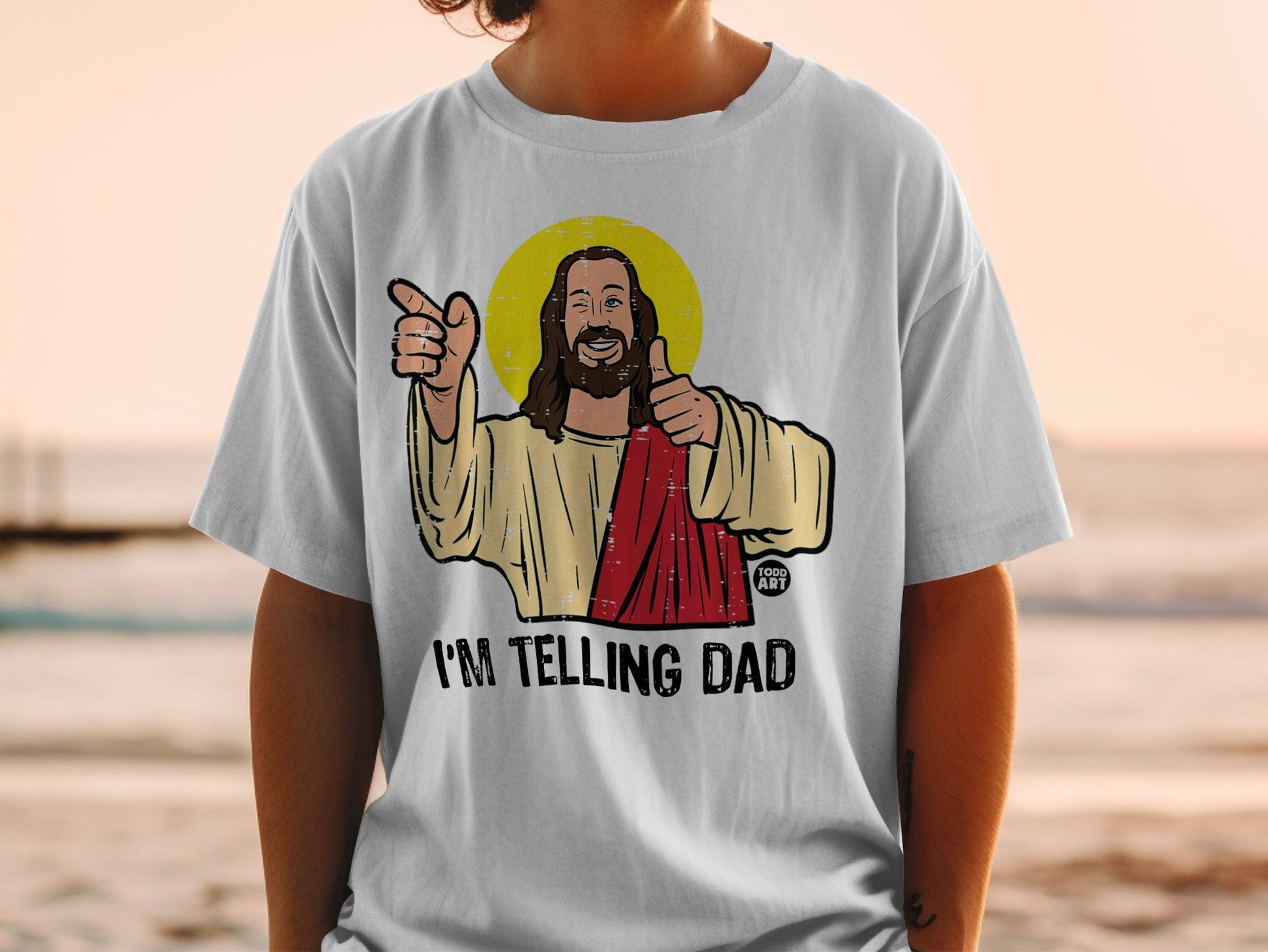 T-shirt with Jesus graphic and "I'M TELLING DAD" text.